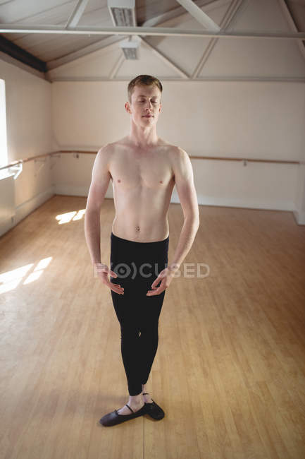 Handsome Ballerino practicing ballet dance in the studio — Stock Photo