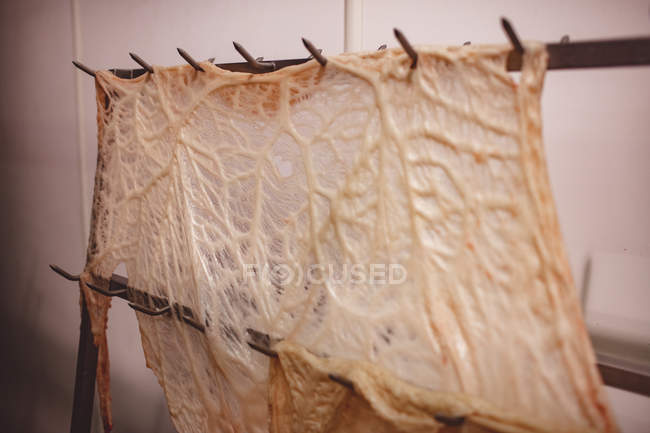 Sheet of beef fats kept on stand at butchers shop — Stock Photo