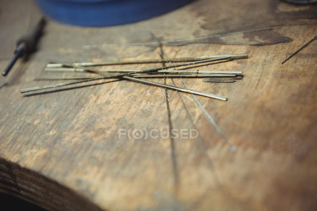 Close-up of welding electrodes on workbench in workshop — Stock Photo
