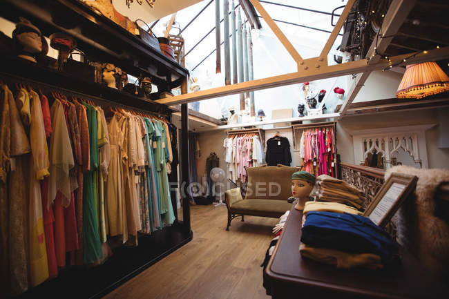 Various clothes in a clothes rack at boutique store — Stock Photo