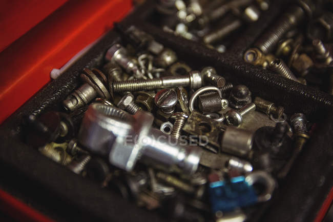 Various screws and nuts in box at workshop — Stock Photo