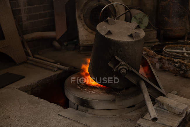 Flask heating on furnace in foundry — Stock Photo