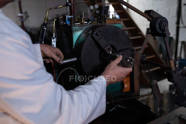 Mid section of male worker working in glass factory — Stock Photo