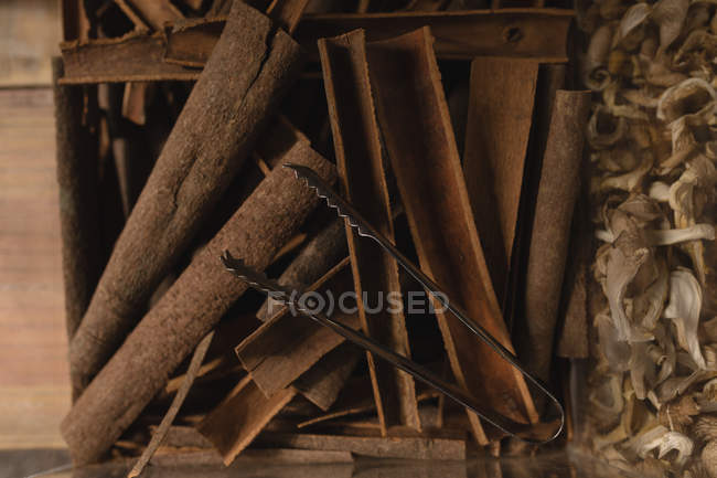 Close-up of cinnamon sticks on display in supermarket — Stock Photo