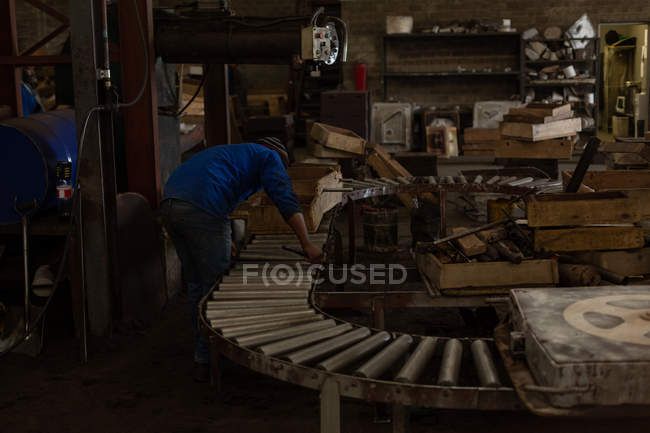 Male worker working in foundry — Stock Photo