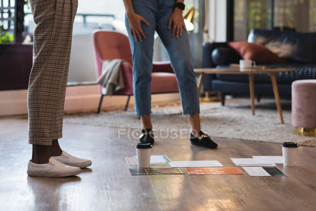 Document and coffee on floor in office — Stock Photo