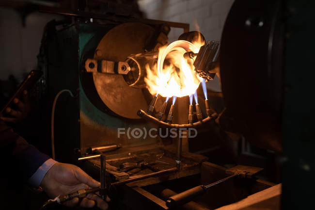 Close-up of worker working in glass factory — Stock Photo