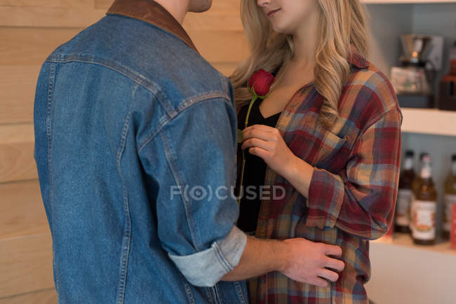 Mid section of couple dancing in cafe — Stock Photo