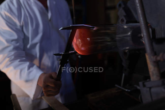 Close-up of worker working in glass factory — Stock Photo