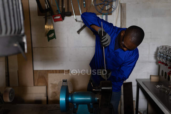 Male worker working in glass factory — Stock Photo