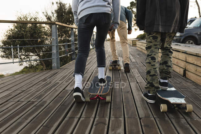 Low section of skateboarders skating at observation point — Stock Photo