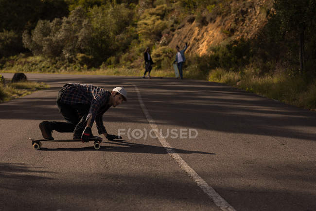 Young skateboarders skating on downhill — Stock Photo