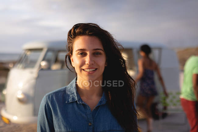 Portrait of a beautiful Caucasian woman standing at beach on a sunny day — Stock Photo