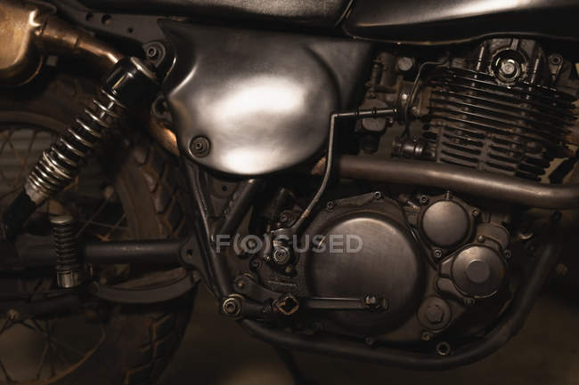 Close-up of motorbike engine in garage — Stock Photo