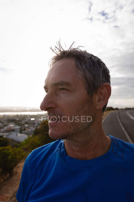 Portrait of exhausted mature Caucasian man looking away — Stock Photo