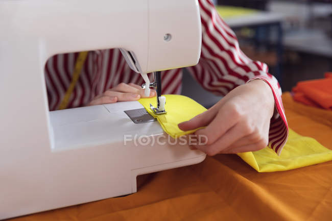Front view mid section of female fashion student working on a design in a studio at fashion college — Stock Photo