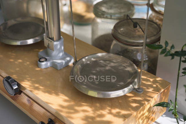 Close up of scientific weight scale on table in lab — Stock Photo
