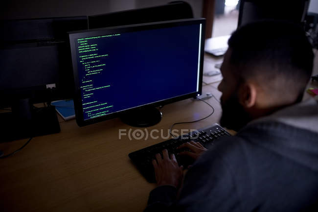 Attentive executive working on personal computer at desk in office — Stock Photo