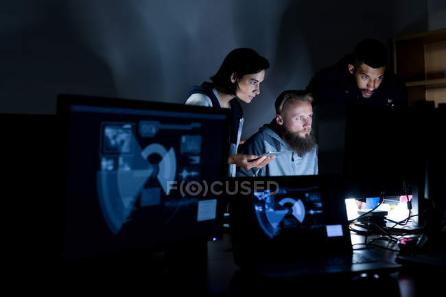 Colleagues working on personal computer at desk in office — Stock Photo
