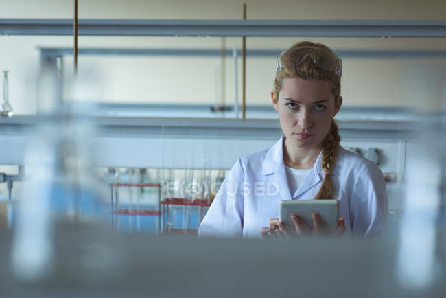 Portrait of university student using digital tablet in laboratory — Stock Photo
