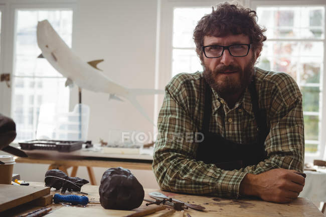 Portrait of confidence craftsman in workshop — Stock Photo