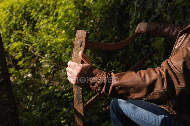 Mid-section of thoughtful man standing in forest — Stock Photo