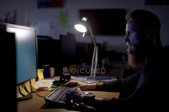 Executive working on personal computer at desk in office — Stock Photo