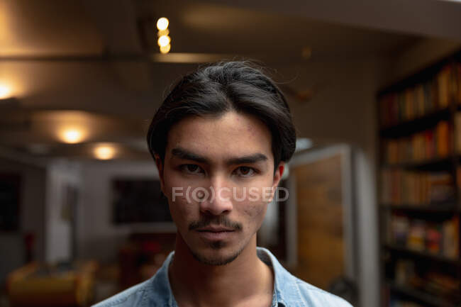 Self isolation in lockdown quarantine. portrait of a young mixed race man enjoying time at home, standing in the living room, looking straight into a camera. — Stock Photo