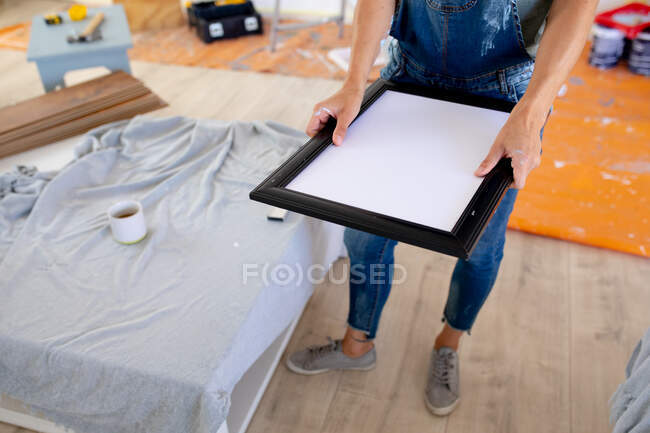 Low section of woman spending time at home self isolating and social distancing in quarantine lockdown during coronavirus covid 19 epidemic, doing DIY at home — Stock Photo