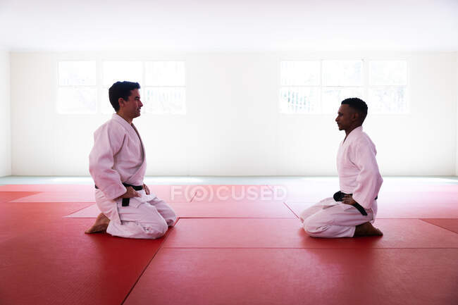 Judoka looking each other before judo training — Stock Photo