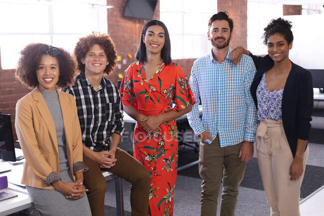 Portrait of diverse business colleagues group at the office looking to camera smiling. independent creative design business. — Stock Photo