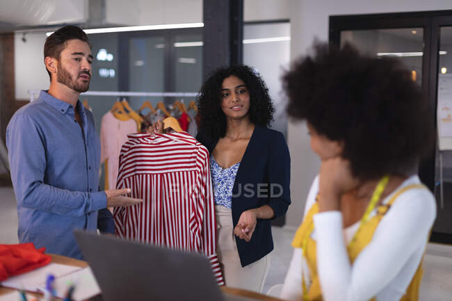Diverse group of creative fashion designers colleagues in discussion at work. independent creative design business. — Stock Photo