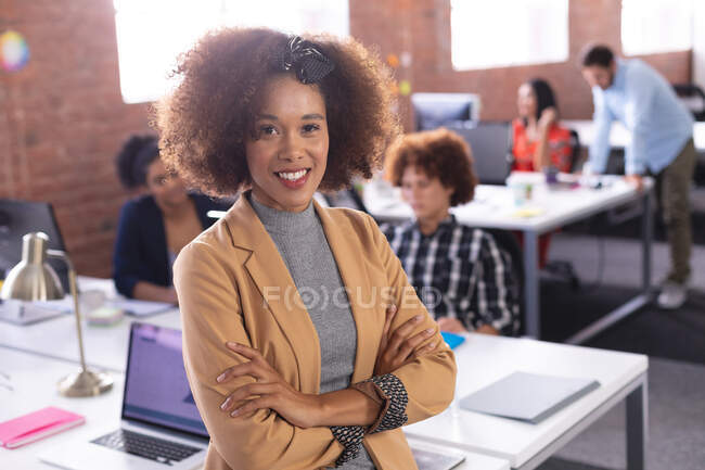 Portrait of african american businesswoman at the office looking to camera. independent creative design business. — Stock Photo