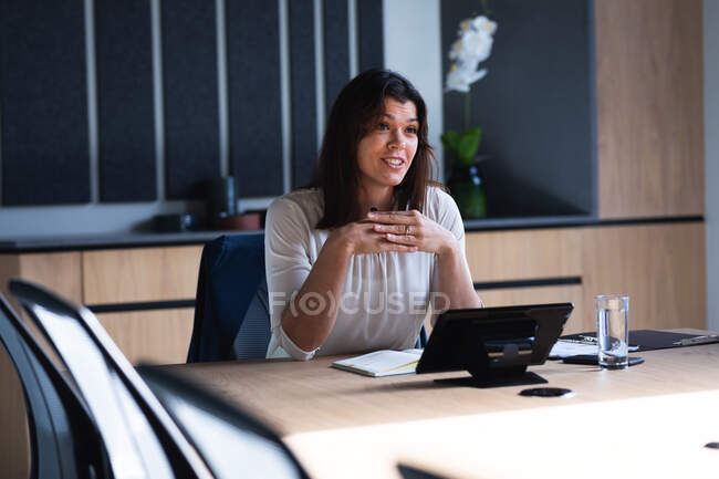 Caucasian businesswoman using laptop while sitting in meeting room at modern office. business and office concept — Stock Photo
