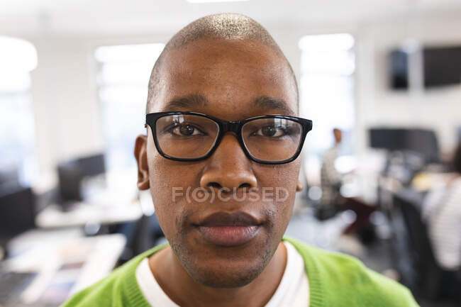 Portrait of african american male creative at work, looking to camera. working in creative business at a modern office. — Stock Photo