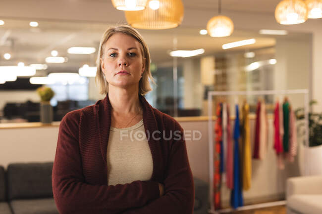 Portrait of caucasian female creative looking to camera. working in creative business at a modern office. — Stock Photo