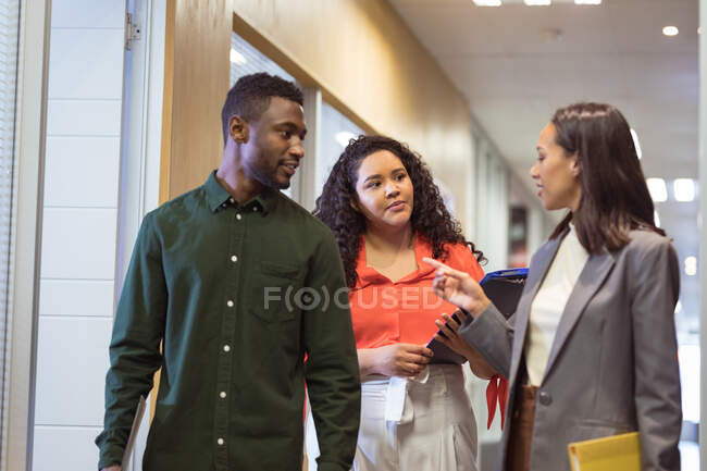 Happy diverse group of business people discussing work in modern office. business and office workplace. — Stock Photo
