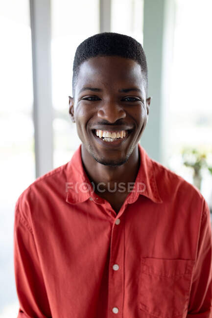 Portrait of cheerful young african american businessman in creative office. creative business and office workplace. — Stock Photo