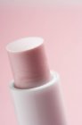 Close-up of classical pink lipstick on pink background — Stock Photo