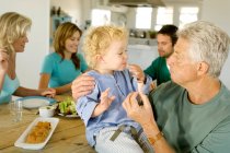 Family having lunch at home — Stock Photo