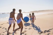 Family playing with a beach ball — Stock Photo