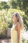 Relaxed woman with eyes closed standing in park — Stock Photo