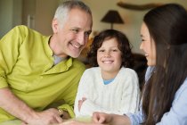 Close-up of a man with his children smiling — Stock Photo