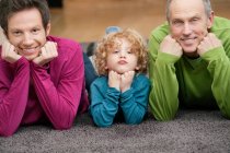 Family smiling together at home — Stock Photo