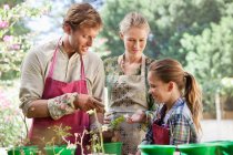 Parents and daughter gardening — Stock Photo