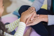 Close-up of mother and daughter holding hands — Stock Photo