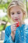 Close-up of blonde cute little girl eating watermelon outdoors — Stock Photo
