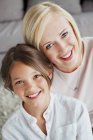 Portrait of a woman smiling with her daughter — Stock Photo