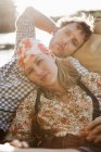 Relaxed young couple resting in boat — Stock Photo