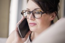 Close-up of woman talking on mobile phone — Stock Photo